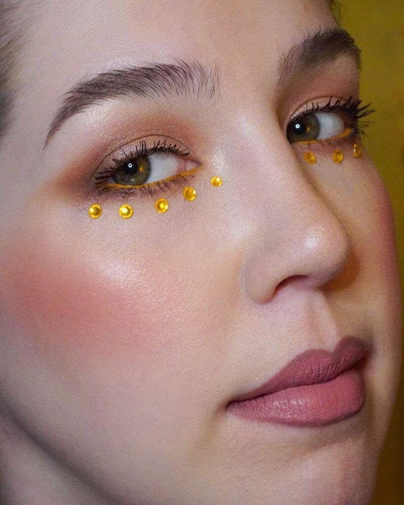 22. Yellow Rhinestone eye makeup